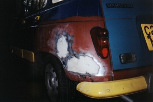 The rear wing of my R4, after the dents had been beaten back into shape and filler applied