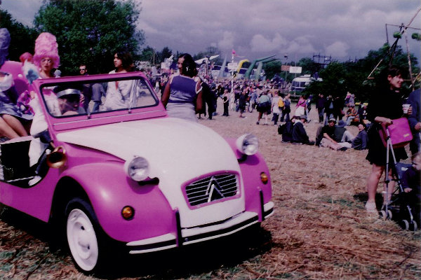 YA2b: The pink and white tin snail against a backdrop of festival-goers