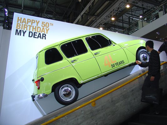 Side view of the R4, showing the slogan on the wall behind 'HAPPY 50TH BIRTHDAY MY DEAR', and a '4L 50 YEARS' decal on the passenger door