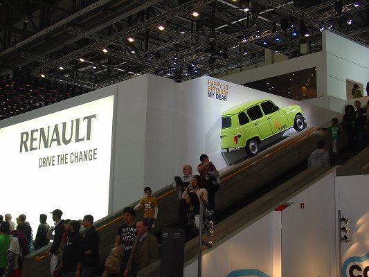 View from the show floor of the visitors passing on the staircase, with the main Renault stand behind