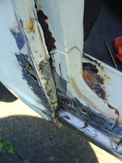 Some nasty rot and large holes had developed beneath the rear passenger door