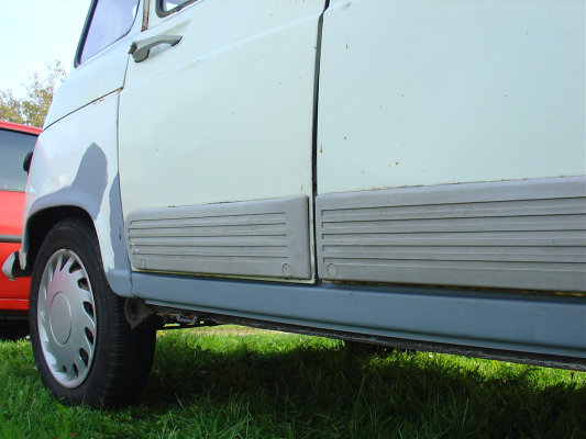 The sill area is completely treated and coated in a layer of grey primer