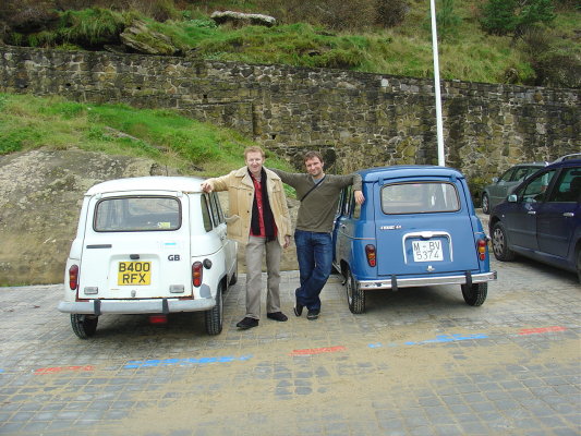 Asier and I standing beside our cars at the waterfront in Donostia