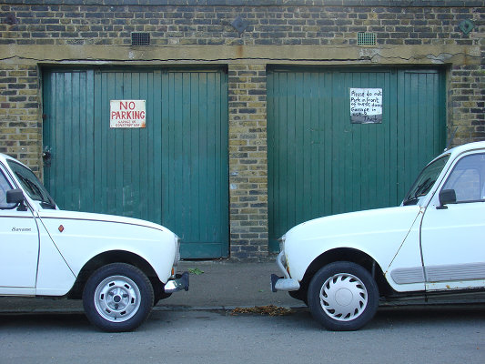 Closer: the twin white frontages of my cars old and new