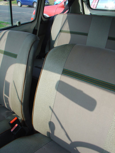 The rather plain interior upholstery of the Savane; beige with brown and green strips