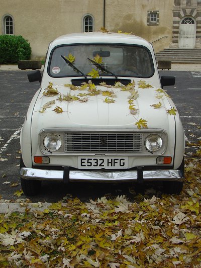Queen Geanine under the fall of autumn leaves, outside the youth hostel in Le Puy-en-Velay, France, November 2010