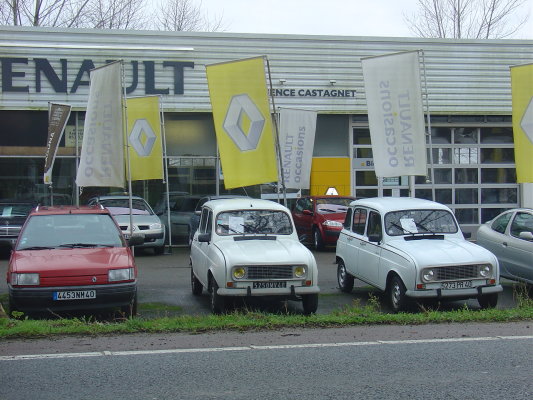 Two white Renault 4s for sale on a Renault forecourt near Cauneille, south-west France