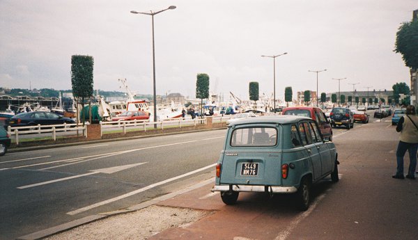 A tatty turquoise Renault 4 Savane with a cracked windscreen, parked down the road from Dieppe railway station